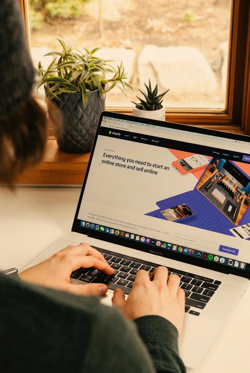 Local business owner working on their website on a laptop